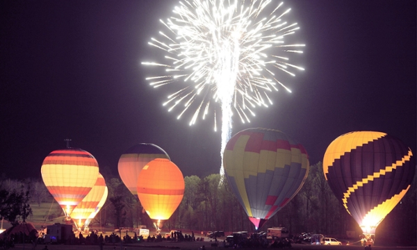 Hot air balloons and a fireworks display.